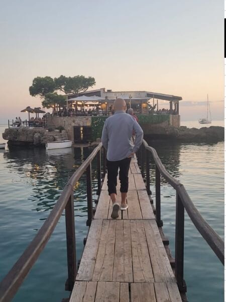 Es Camp de Mar beach and its small island restaurant