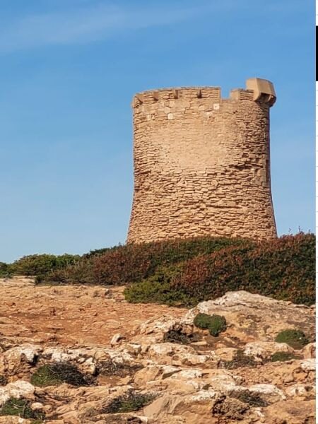 Historic S’Estalella watchtower on the coast of Llucmajor